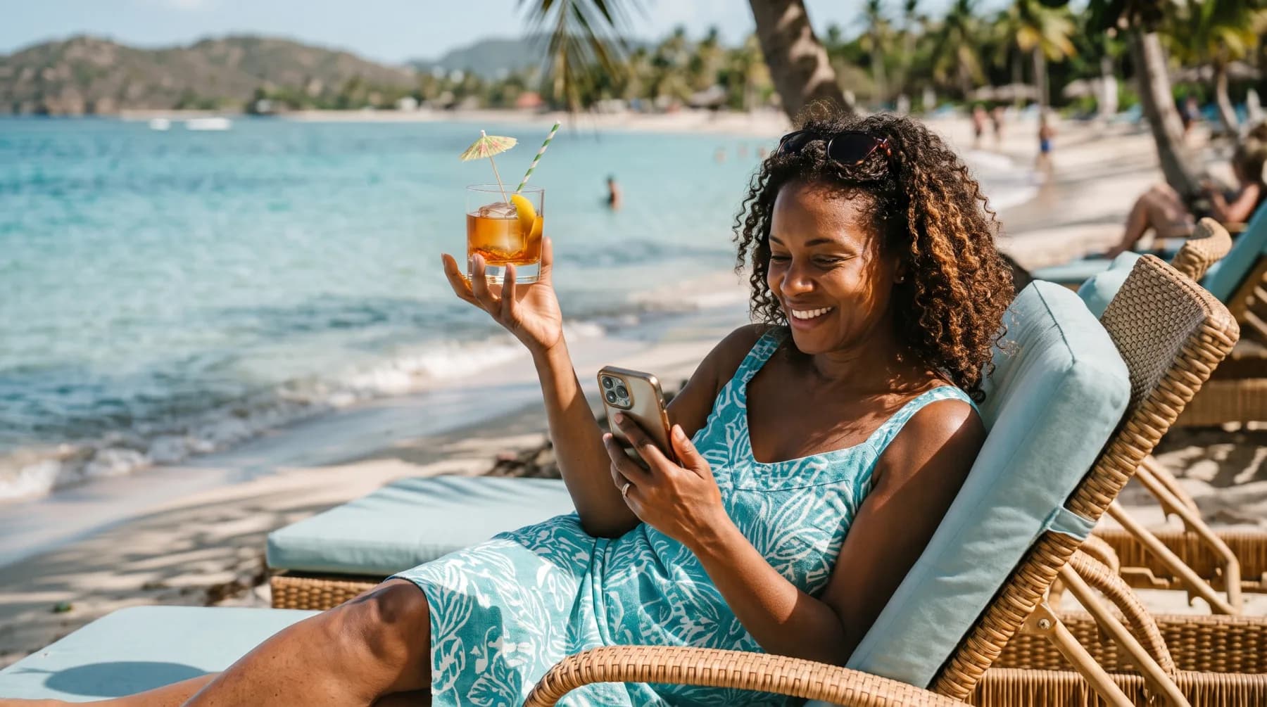 Short-term rental host relaxing on a beach while checking her phone